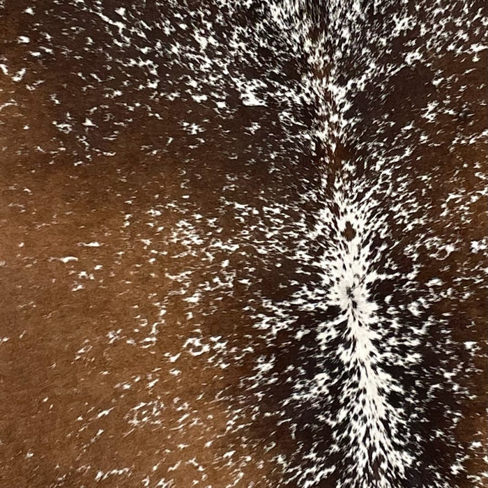 Closeup of this Tricolor, Speckled, Brazilian Cowhide, showing dark brown and golden brown with white speckles and spots (BRSP2269)