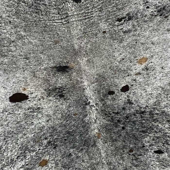 Closeup of this XL, Speckled, Brazilian Cowhide, showing  white with black speckles and spots, and a few small, brown spots (BRSP2280)