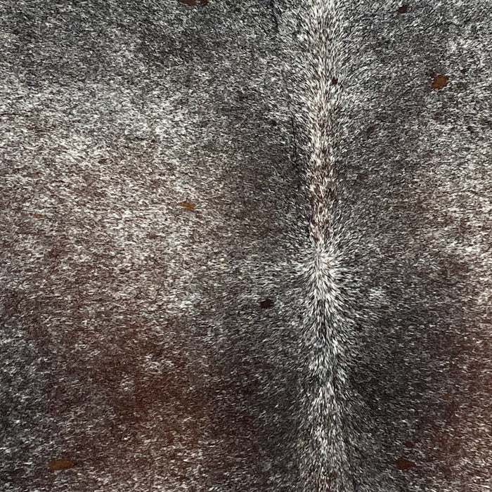 Closeup of this Tricolor, Speckled, Brazilian Cowhide, showing a mix of black and brown, with white speckles and spots (BRSP2570)