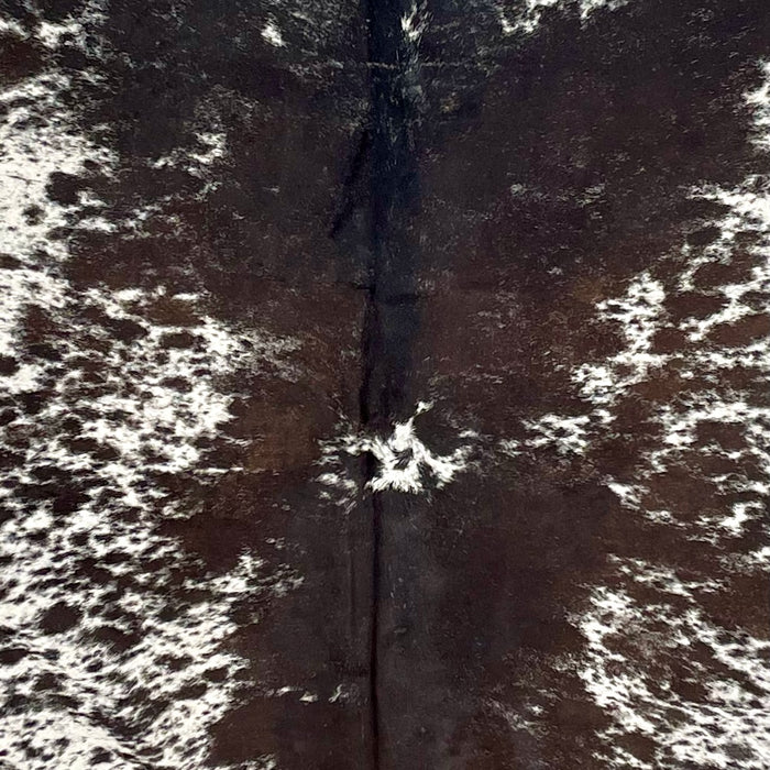 Closeup of this Large, Speckled, Brazilian Cowhide, showing white with blackish brown speckles and large and small spots  (BRSP2634)