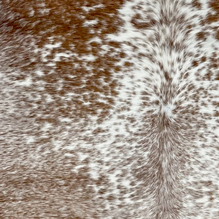 Closeup of this Brown and White Speckled Brazilian Cowhide, showing white with brown speckles and spots - 6'8" x 5'11" (BRSP2715)