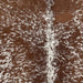 closeup of this Speckled Brazilian Cowhide, showing white with reddish brown speckles and spots (BRSP2754)