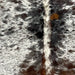 Closeup of this Tricolor Speckled Brazilian Cowhide, showing white with black and brown speckles and spots (BRSP2758)