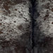 Closeup of this Dark Tricolor Speckled Brazilian Cowhide, showing black, with blackish brown spots, and fine, white speckles, and white spots  (BRSP2768)