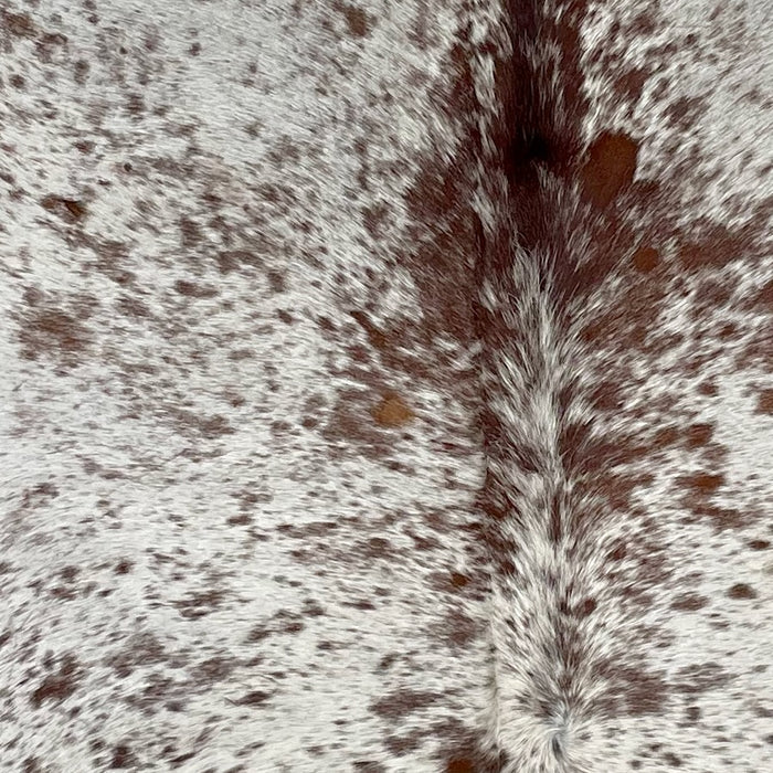 Closeup of this Speckled Brazilian Cowhide, showing white with brown speckles and spots (BRSP2769)