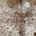 Closeup of this Speckled Brazilian Cowhide, showing white with brown speckles and spots (BRSP2815)