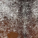 Closeup of this Speckled Brazilian Cowhide, showing white with reddish brown and blackish brown speckles and spots  (BRSP2818)