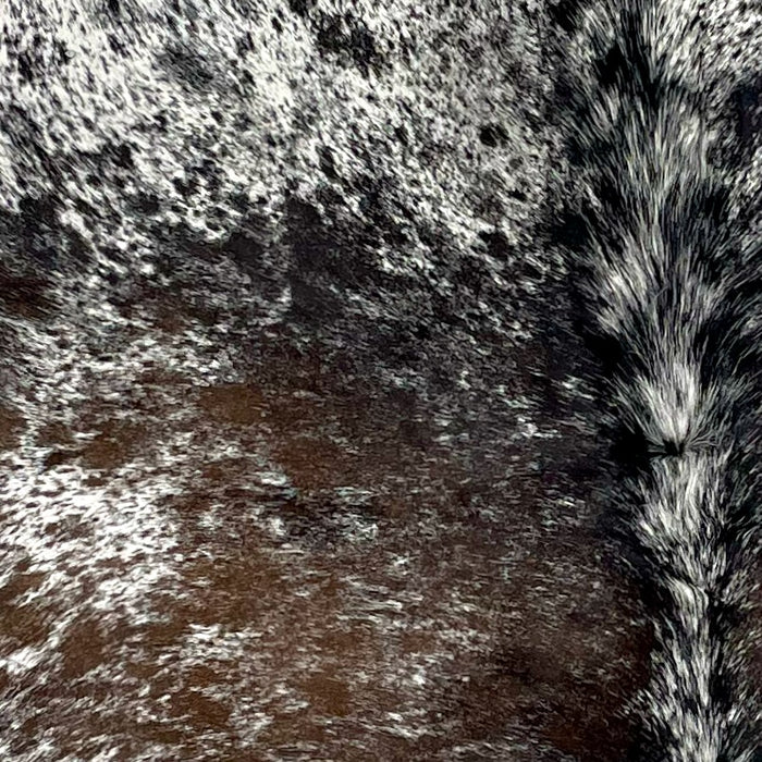 Closeup of this Tricolor Speckled Brazilian Cowhide, showing white with black and brown spots and speckles (BRSP2861)