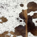 closeup of this Tricolor Cloudy Speckled Brazilian Cowhide, showing white with brown spots and cloudy, brown and black speckles  (BRSP2964)