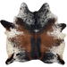 Tricolor Speckled Brazilian Cowhide: off-white with reddish brown and black speckles and spots, and it has a mix of mostly solid reddish brown and black down the middle of the back - 7' x 6'6" (BRSP3097)
