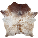 Brown and White Speckled Brazilian Cowhide: off-white with caramel speckles and spots on the back and belly, and off-white with dark brown speckles and spots on the shoulder, butt, and shanks, and two brand marks on the butt, and one on the shoulder - 6'8" x 5'6" (BRSP3107)