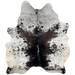 Dark Tricolor Speckled Brazilian Cowhide: 
white with black and blackish brown speckles and spots, and it has a mix of black and blackish brown down both sides of the spine, and one brand mark on the right side of the butt - 7'3" x 6' (BRSP3173)