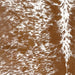 Closeup of this Speckled Brazilian Cowhide, showing white with brown speckles and spots (BRSP3197)