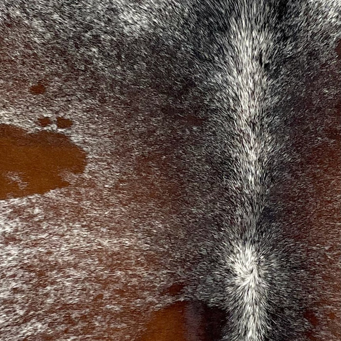 Closeup of this Tricolor Speckled Brazilian Cowhide, showing white with reddish brown and black speckles and spots  (BRSP3202)