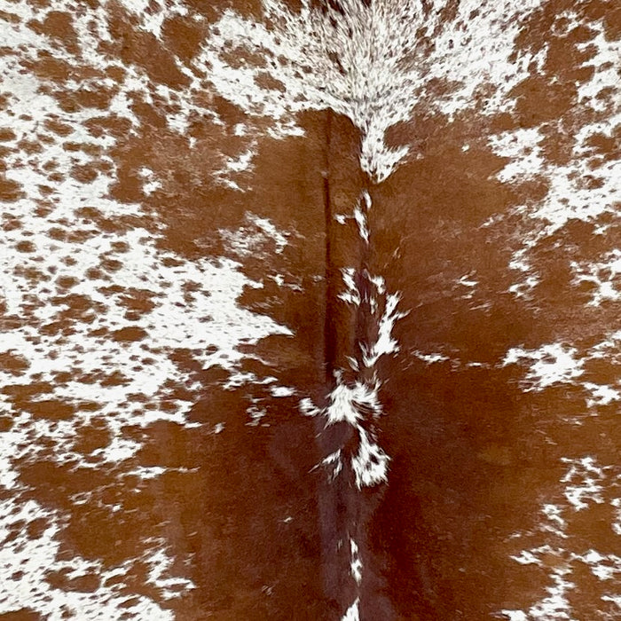 Closeup of this Large Speckled Brazilian Cowhide, showing white with reddish brown speckles and spots (BRSP3237)