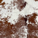 Closeup of this Speckled Brazilian Cowhide, showing white with reddish brown speckles and spots (BRSP3243)