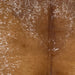 Closeup of this Speckled Brazilian Cowhide, showing caramel down the middle of the back, and white with caramel speckles and spots on the belly and shoulder (BRSP3254)