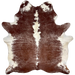 Large Brown and White Speckled Brazilian Cowhide: has long hair that is brown with white speckles, a few white spots, and off-white on the belly and down part of the spine- 7'7" x 6'1" (BRSP3257)