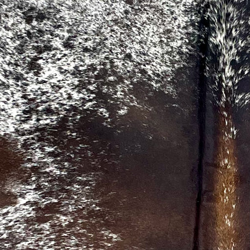 Closeup of this Tricolor Speckled Brazilian Cowhide, showing white with dark brown and black speckles and spots  (BRSP3292)