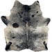 Large Black and Off-White Speckled Brazilian Cowhide: off-white with black speckles and spots, a splash of dark brown on the spine, and two brand mark on the left side of the butt - 7'5" x 6' (BRSP3298)