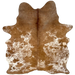 Brown and White Speckled Brazilian Cowhide: white with brown speckles and spots, and mostly solid brown on the shoulder and down the middle, and one brand mark on the left side of the back - 5'11" x 4'8" (BRSP3324)