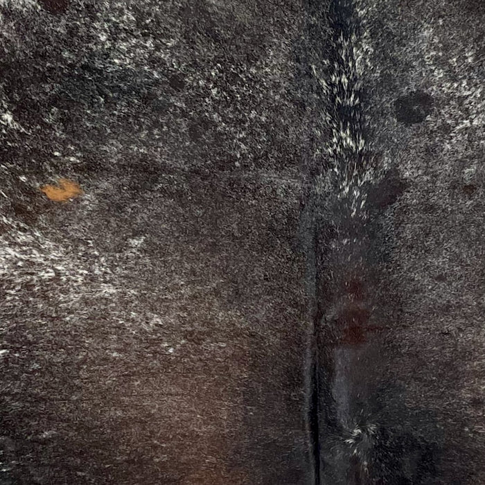 Closeup of this Dark Tricolor Speckled Brazilian Cowhide, showing a mix of black and dark brown with white speckles  (BRSP3331)