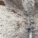 closeup of this Large Speckled Brazilian Cowhide, showing white with dark brown speckles and spots (BRSP3359)