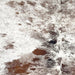 Closeup of this Tricolor Speckled Brazilian Cowhide, showing white with reddish brown, blackish brown , and black speckles and spots (BRSP3377)