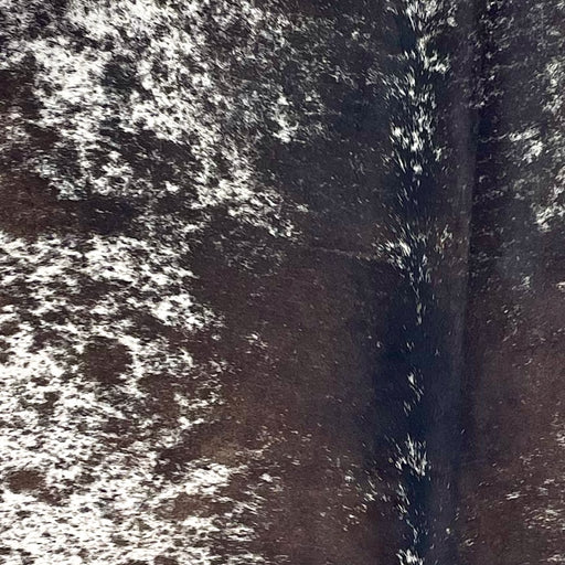 Closeup of this Speckled Brazilian Cowhide, showing white with dark brown spots and speckles (BRSP3381)