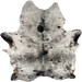 Large Black & Off-White Speckled Brazilian Cowhide: off-white with black speckles and spots, a few small, brown spots, and two brand marks on the right side of the butt - 7'9" x 5'11" (BRSP3394)