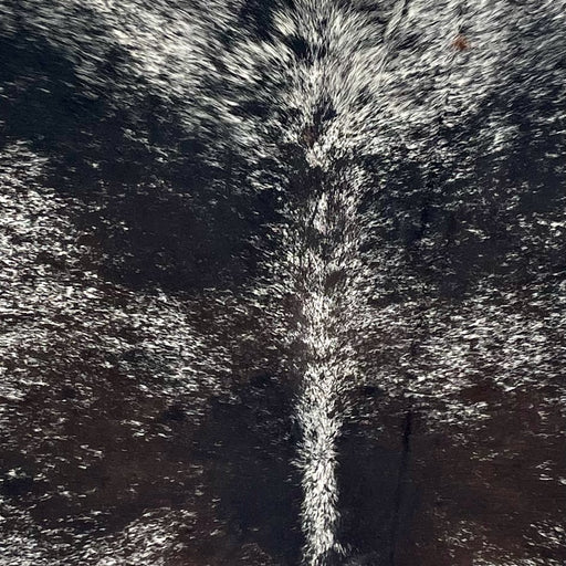 Closeup of this Large Dark Tricolor Speckled Brazilian Cowhide, showing white with black speckles and black and dark brown spots (BRSP3445)