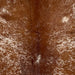 Closeup of this Speckled Brazilian Cowhide, showing reddish brown with white speckles and spots (BRSP3453)