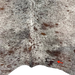 Closeup of this Tricolor Speckled Brazilian Cowhide, showing one brand mark on the right side of the butt (BRSP3463)