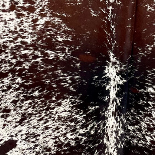 Closeup of this Tricolor Speckled Brazilian Cowhide, showing white with brown and black speckles and spots (BRSP3477)