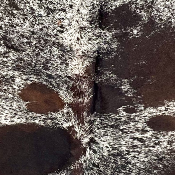 Closeup of this Dark Tricolor Speckled Brazilian Cowhide, showing white with black and dark brown speckles and spots  (BRSP3503)