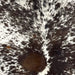 Closeup of this Tricolor Speckled Brazilian Cowhide, showing off-white with black and brown spots and speckles  (BRSP3514)