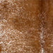 Closeup of this Speckled Brazilian Cowhide, showing white with reddish brown speckles and spots (BRSP3516)
