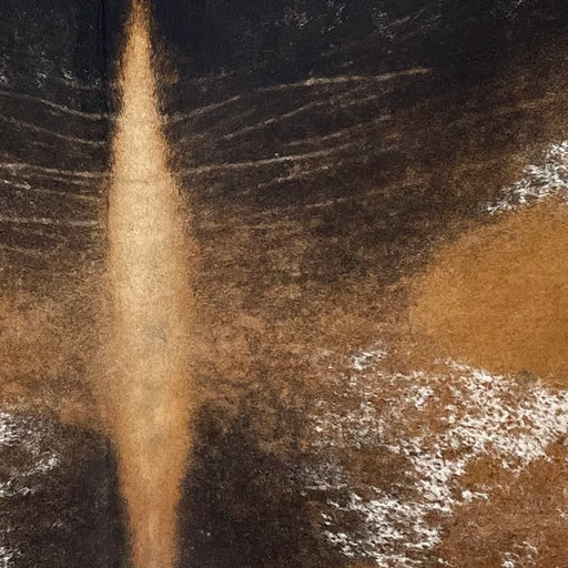 Closeup of this Tricolor Speckled Brazilian Cowhide, showing white with golden brown, dark brown, and black spots and speckles (BRSP3612)