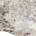Closeup of this Tricolor Speckled Brazilian Cowhide, showing one brand mark on the right side of the butt (BRSP3635)