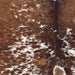 closeup of this Speckled Brazilian Cowhide, showing brown with white speckles and spots (BRSP3652)