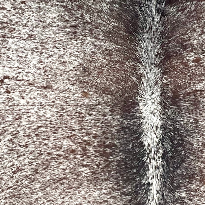 Closeup of this Speckled Brazilian Cowhide, showing white with brown speckles and spots (BRSP3690)