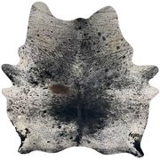 Large Black and White Speckled Brazilian Cowhide: white with black speckles and spots, one brown spot on the left side of the back, and two brand marks on the right side of the butt - 7'9" x 6'6" (BRSP3693)