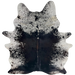 Large Black and White Speckled Brazilian Cowhide: mostly solid black down the middle, dark brown down part of the spine, and white with black speckles and spots on the belly, butt, shoulder, and shanks - 7'7" x 5'6" (BRSP3698)