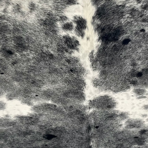 Closeup of this XL Speckled Brazilian Cowhide, showing white and off-white with black speckles and spots (BRSP3710)