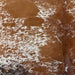 Closeup of this Tricolor Speckled Brazilian Cowhide, showing white with brown speckles and spots, and black speckles on the butt (BRSP3761)