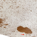 Closeup of this Large White and Brown Speckled Brazilian Cowhide, showing one brand mark on the right side of the butt  (BRSP3765)