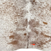 Closeup of this Large White and Brown Speckled Brazilian Cowhide, showing one brand mark on the right side of the butt  (BRSP3766)