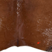 Closeup of this Speckled Brazilian Cowhide, showing one brand mark on the left side of the butt (BRSP3794)