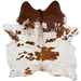 Reddish Brown and White Cloudy Speckled Brazilian Cowhide: white with cloudy, reddish brown speckles and spots, and one brand mark on the left side of the butt - 7' x 6'5"   (BRSP3805)