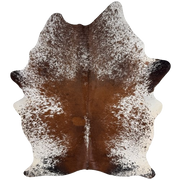 Reddish Brown and White Speckled Brazilian Cowhide: white with reddish brown speckles and spots on the back, chocolate speckles on the shoulder, and black speckles and spots on the butt and shanks - 7'6" x 5'5" (BRSP3818)